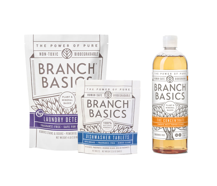 A bottle of Branch Basics Concentrate, a pouch of Dishwasher Tablets, and a pouch of Laundry Detergent are displayed on a white background.